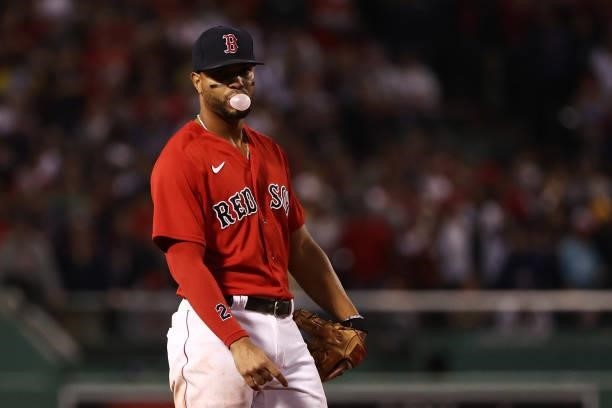 Xander Bogaerts of the Boston Red Sox blows a bubble in the seventh inning against the Tampa Bay Rays during Game 4 of the American League Division...