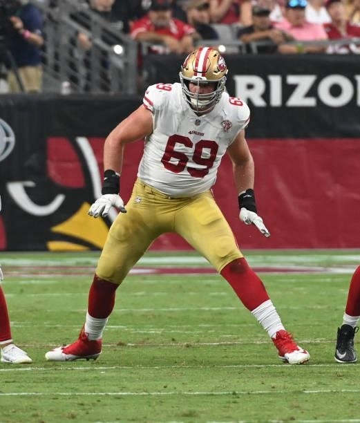 Mike McGlinchey of the San Francisco 49ers pass blocks against the Arizona Cardinals at State Farm Stadium on October 10, 2021 in Glendale, Arizona.