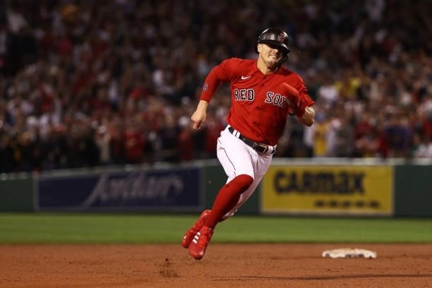Enrique Hernandez of the Boston Red Sox runs to third on a single by Rafael Devers in the seventh inning against the Tampa Bay Rays during Game 4 of...