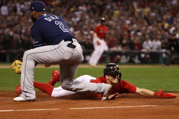 Enrique Hernandez of the Boston Red Sox runs to third on a single by Rafael Devers in the seventh inning against the Tampa Bay Rays during Game 4 of...