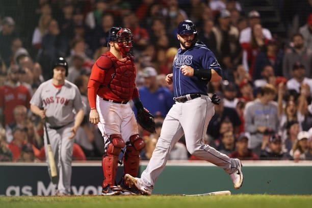 Mike Zunino of the Tampa Bay Rays scores a run in the eighth inning against the Boston Red Sox during Game 4 of the American League Division Series...