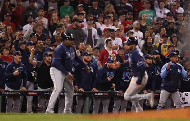 The Tampa Bay Rays bench cheers as Kevin Kiermaier runs to score a run in the eighth inning against the Boston Red Sox during Game 4 of the American...
