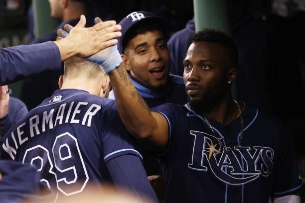 Randy Arozarena of the Tampa Bay Rays celebrates with teammates after his RBI double in the eighth inning against the Boston Red Sox during Game 4 of...