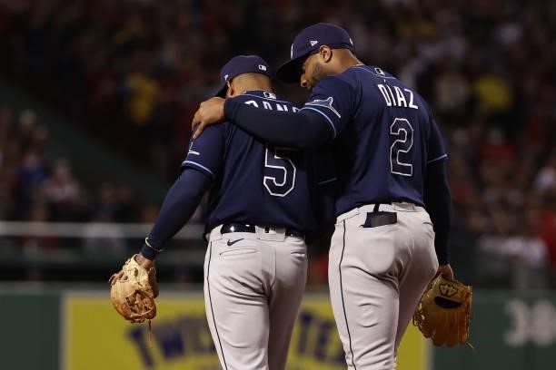 Yandy Diaz comforts Wander Franco of the Tampa Bay Rays after his throwing error in the eighth inning against the Boston Red Sox during Game 4 of the...
