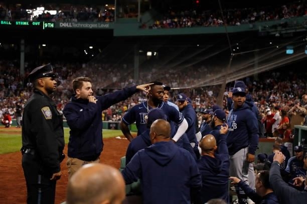 Tampa Bay Rays player react after fans threw drinks into their dugout during Game 4 of the American League Division Series against the Boston Red Sox...