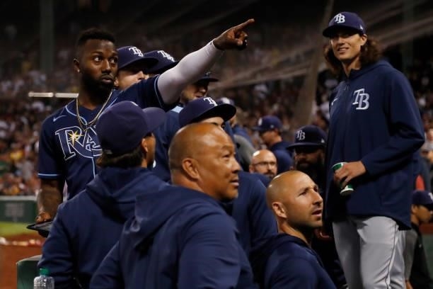 Tampa Bay Rays players including Randy Arozarena react after fans threw drinks into their dugout during Game 4 of the American League Division Series...