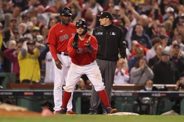 Christian Vazquez of the Boston Red Sox celebrates a single by Travis Shaw in the ninth inning against the Tampa Bay Rays during Game 4 of the...