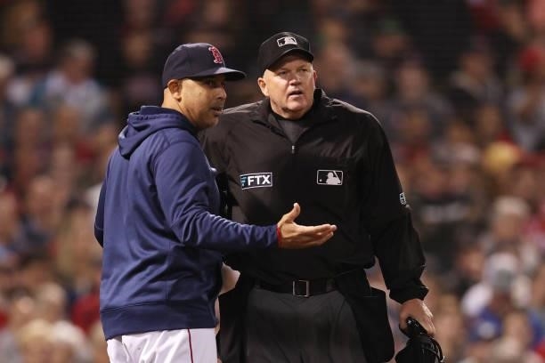 Alex Cora of the Boston Red Sox speaks to an umpire in the ninth inning against the Tampa Bay Rays during Game 4 of the American League Division...