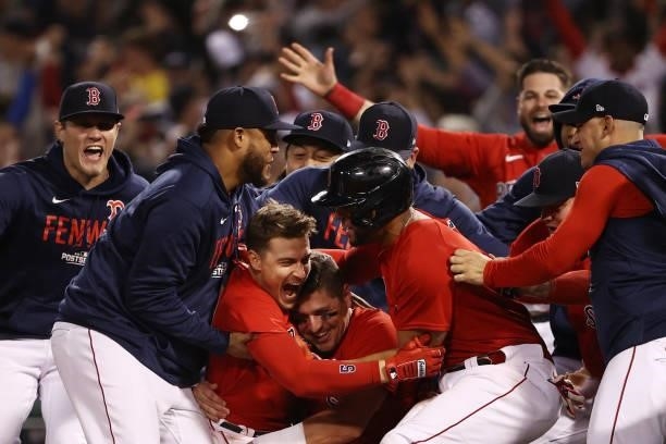 Enrique Hernandez of the Boston Red Sox celebrates with teammates after they defeated the Tampa Bay Rays 6 to 5 during Game 4 of the American League...