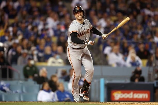 Buster Posey of the San Francisco Giants reacts after his pop fly out against the Los Angeles Dodgers during the sixth inning in game 3 of the...