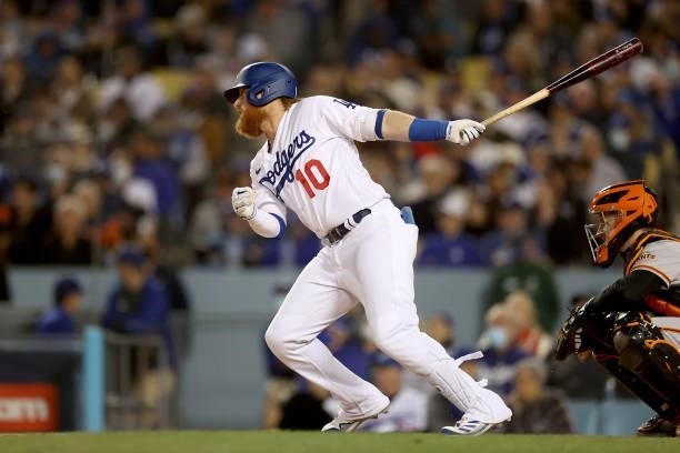Justin Turner of the Los Angeles Dodgers hits a single against the San Francisco Giants during the sixth inning in game 3 of the National League...