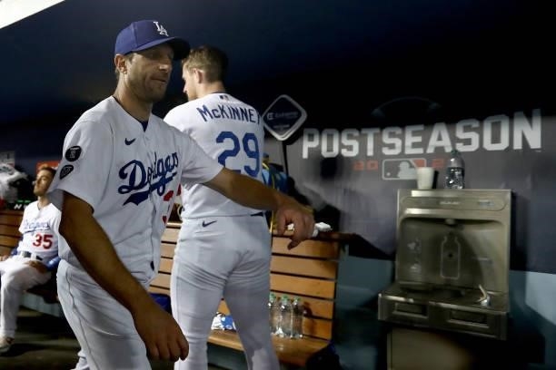 Max Scherzer of the Los Angeles Dodgers walks in the dugout after the seventh inning in game 3 of the National League Division Series against the San...