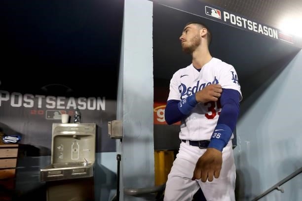 Cody Bellinger of the Los Angeles Dodgers stands in the dugout against the San Francisco Giants during the seventh inning in game 3 of the National...