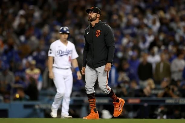 Manager Gabe Kapler of the San Francisco Giants makes a pitching change in the seventh inning of game 3 of the National League Division Series...