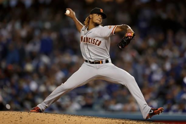 Camilo Doval of the San Francisco Giants pitches against the Los Angeles Dodgers during the eighth inning in game 3 of the National League Division...