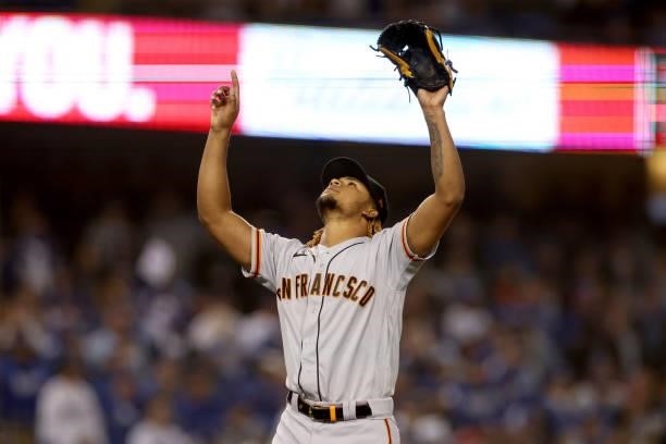 Camilo Doval of the San Francisco Giants celebrates an out against Justin Turner of the Los Angeles Dodgers to end the eighth inning in game 3 of the...