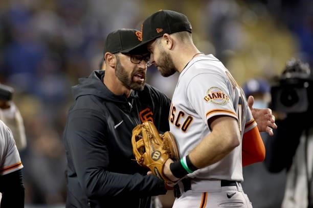 Manager Gabe Kapler celebrates with Evan Longoria of the San Francisco Giants after beating the Los Angeles Dodgers 1-0 in game 3 of the National...