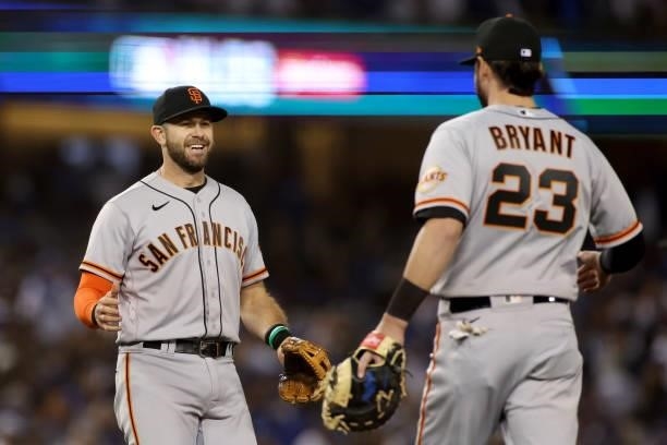 Evan Longoria and Kris Bryant of the San Francisco Giants celebrate after beating the Los Angeles Dodgers 1-0 in game 3 of the National League...
