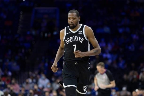 Kevin Durant of the Brooklyn Nets looks on against the Philadelphia 76ers at the Wells Fargo Center on October 11, 2021 in Philadelphia,...