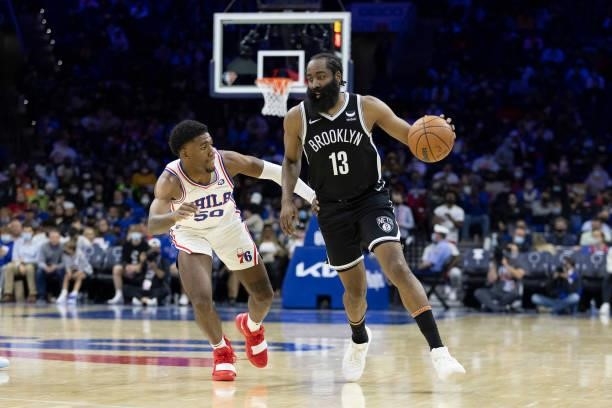 James Harden of the Brooklyn Nets dribbles the ball against Aaron Henry of the Philadelphia 76ers at the Wells Fargo Center on October 11, 2021 in...
