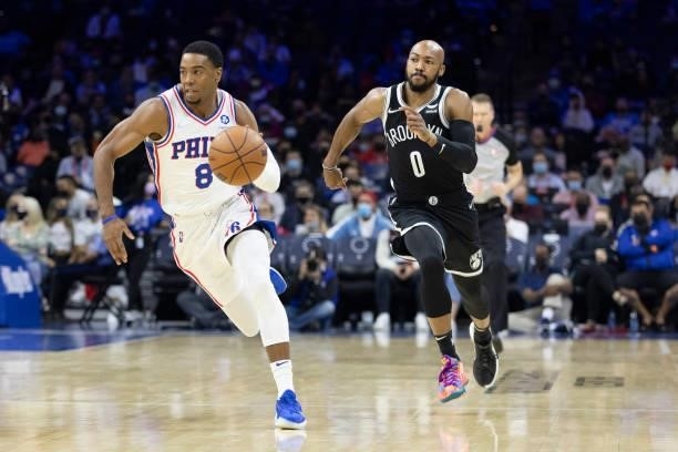 Shaquille Harrison of the Philadelphia 76ers dribbles the ball against Jevon Carter of the Brooklyn Nets at the Wells Fargo Center on October 11,...