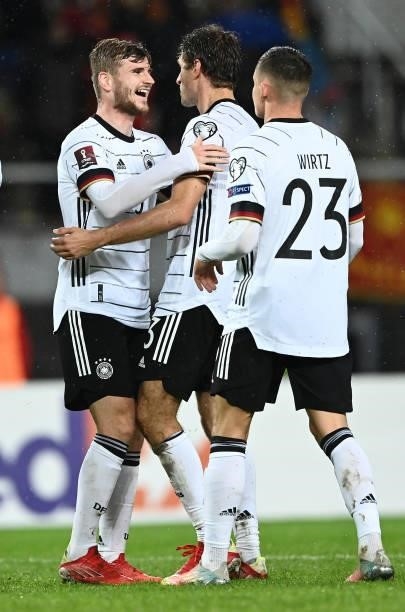 Timo Werner of Germany celebrates with Thomas Mueller and Florian Wirtz during the 2022 FIFA World Cup Qualifier match between North Macedonia and...