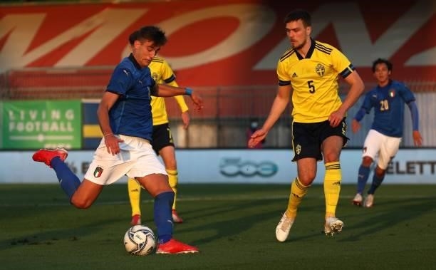 Lorenzo Lucca of Italy is challenged by Pavle Vagic of Sweden during the 2022 UEFA European Under-21 Championship Qualifier match between Italy and...