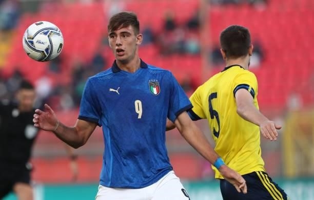Lorenzo Lucca of Italy is challenged by Pavle Vagic of Sweden during the 2022 UEFA European Under-21 Championship Qualifier match between Italy and...