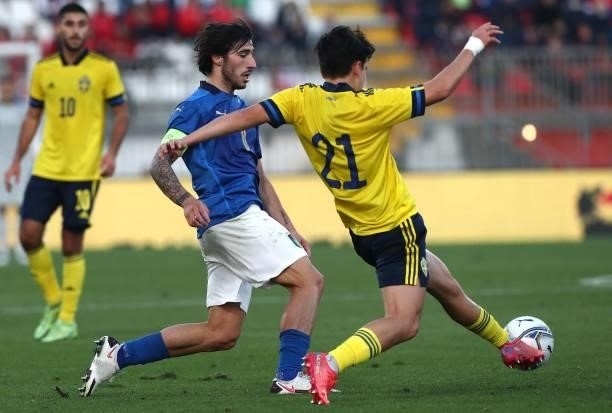 Sandro Tonali of Italy competes for the ball with Eric Kahl of Sweden during the 2022 UEFA European Under-21 Championship Qualifier match between...