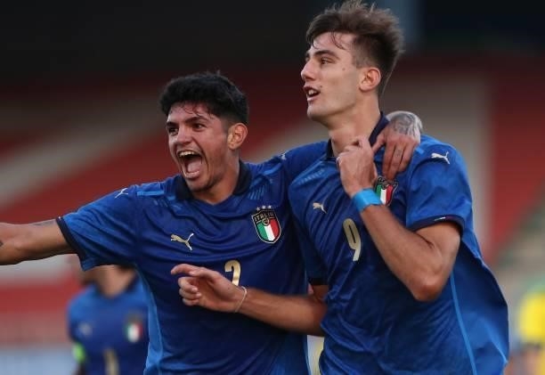 Lorenzo Lucca of Italy celebrates with his team-mate Raoul Bellanova after scoring the opening goal during the 2022 UEFA European Under-21...