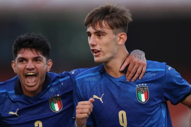 Lorenzo Lucca of Italy celebrates with team mate Raoul Bellanova after scoring to give the side a 1-0 lead during the 2022 UEFA European Under-21...