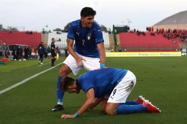Lorenzo Lucca of Italy celebrates with his team-mate Raoul Bellanova after scoring the opening goal during the 2022 UEFA European Under-21...