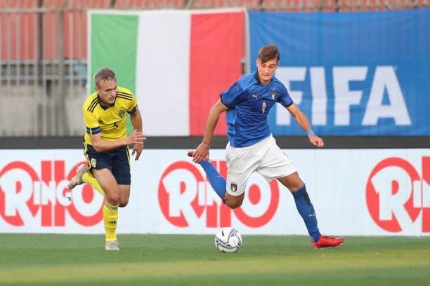 Lorenzo Lucca of Italy takes on Jesper Tolinsson of Sweden during the 2022 UEFA European Under-21 Championship Qualifier match between Italy and...