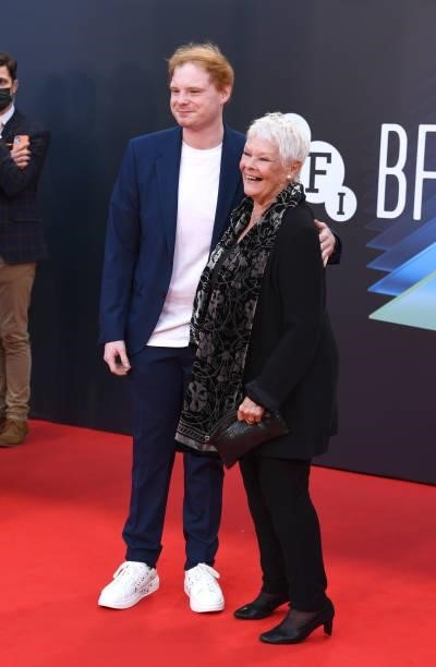 Dame Judi Dench and guest attend the "Belfast
