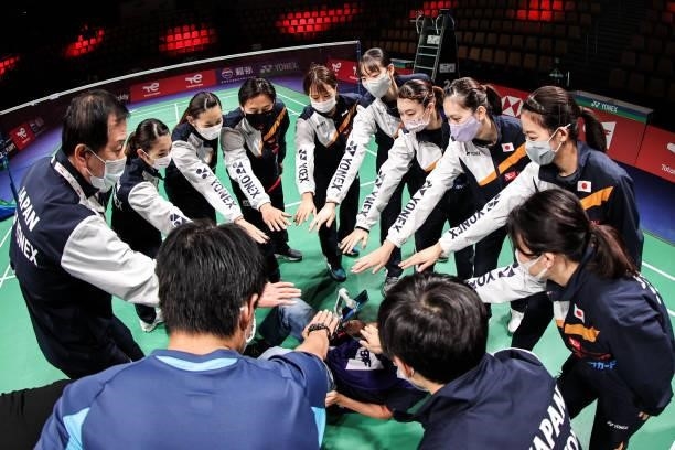 Team Japan build a circle to cheer before the match against Team Indonesia during day four of the Thomas & Uber Cup on October 12, 2021 in Aarhus,...