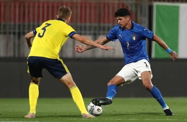 Raoul Bellanova of Italy competes for the ball with Jesper Tolinsson of Sweden during the 2022 UEFA European Under-21 Championship Qualifier match...
