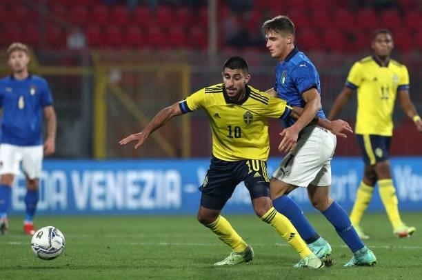 Rami Hajal of Sweden competes for the ball with Lorenzo Colombo of Italy during the 2022 UEFA European Under-21 Championship Qualifier match between...