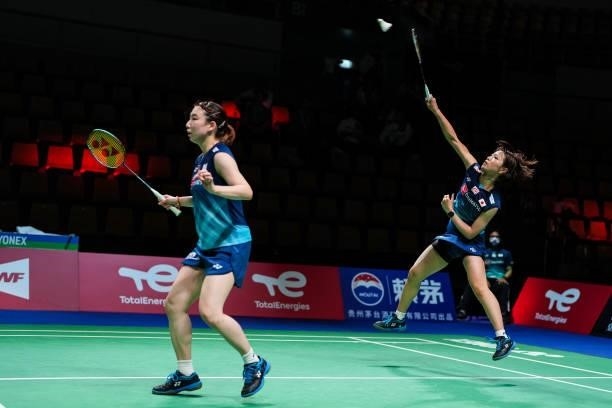 Yuki Fukushima and Arisa Higashino of Japan compete in the Women's Double match against Nita Violina Marwah and Putri Syaikah of Indonesia during day...