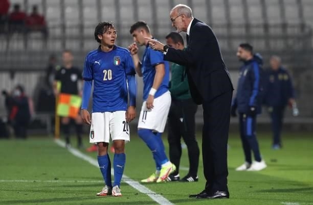Italy coach Paolo Nicolato issues instructions to his player Emanuel Vignato during the 2022 UEFA European Under-21 Championship Qualifier match...