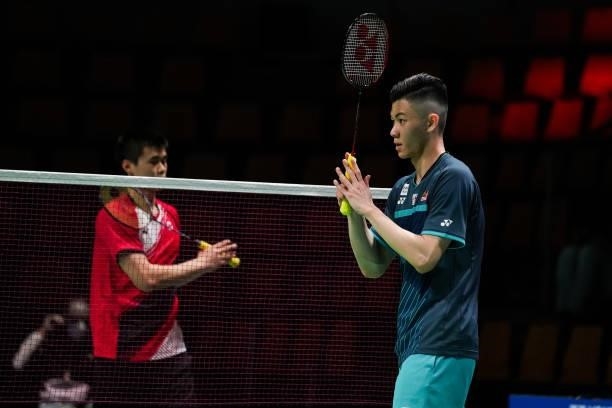 Lee Zii Jia of Malaysia greets Brian Yang of Canada after their Men's Single match during day four of the Thomas & Uber Cup on October 12, 2021 in...