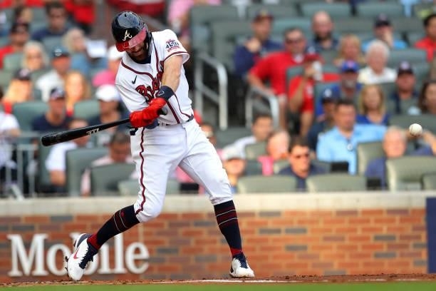 Dansby Swanson of the Atlanta Braves doubles during the first inning against the Milwaukee Brewers in game four of the National League Division...