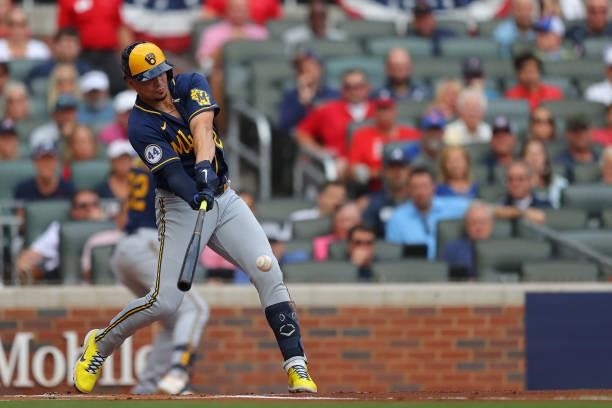 Willy Adames of the Milwaukee Brewers singles during the first inning against the Atlanta Braves in game 4 of the National League Division Series at...
