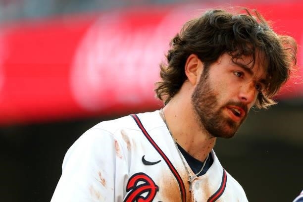 Dansby Swanson of the Atlanta Braves after sliding into third during the first inning against the Milwaukee Brewers in game four of the National...