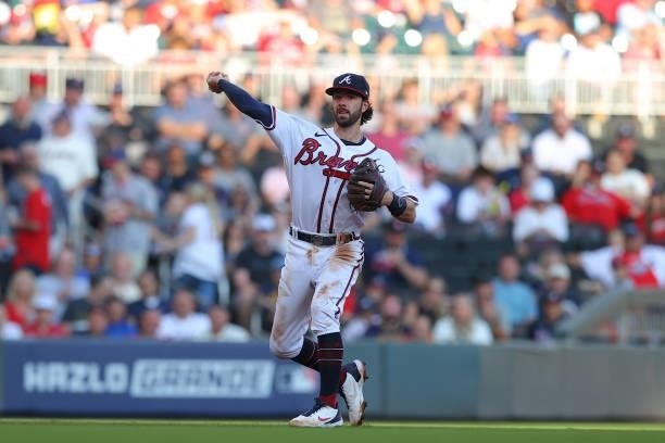 Dansby Swanson of the Atlanta Braves throws to first during the second inning against the Milwaukee Brewers in game four of the National League...