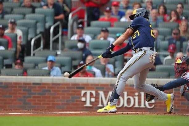 Willy Adames of the Milwaukee Brewers hits a base hit during the first inning against the Atlanta Braves in game 4 of the National League Division...