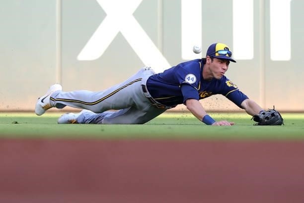 Christian Yelich of the Milwaukee Brewers unable to make a catch during the second inning against the Atlanta Braves in game four of the National...