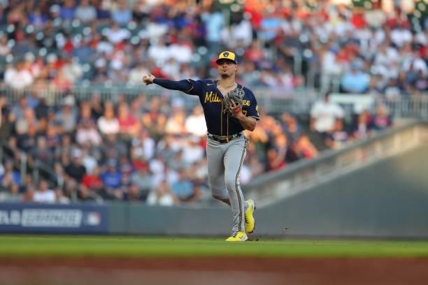 Willy Adames of the Milwaukee Brewers throws to first during the third inning against the Atlanta Braves in game four of the National League Division...