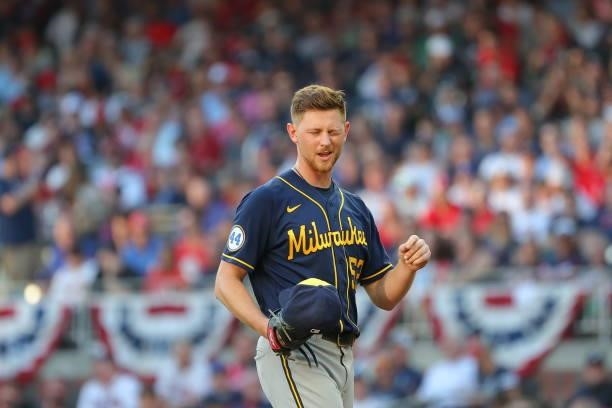 Eric Lauer of the Milwaukee Brewers with something in his eye during the third inning against the Atlanta Braves in game four of the National League...