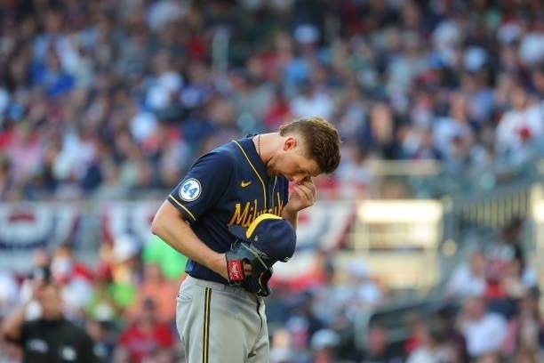 Eric Lauer of the Milwaukee Brewers with something in his eye during the third inning against the Atlanta Braves in game four of the National League...
