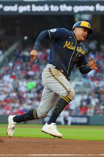 Avisail Garcia of the Milwaukee Brewers advances to third on the way to scoring during the fourth inning against the Atlanta Braves in game four of...